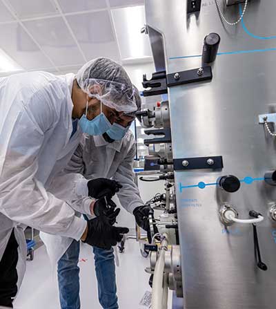Scientists working at a bioreactor.