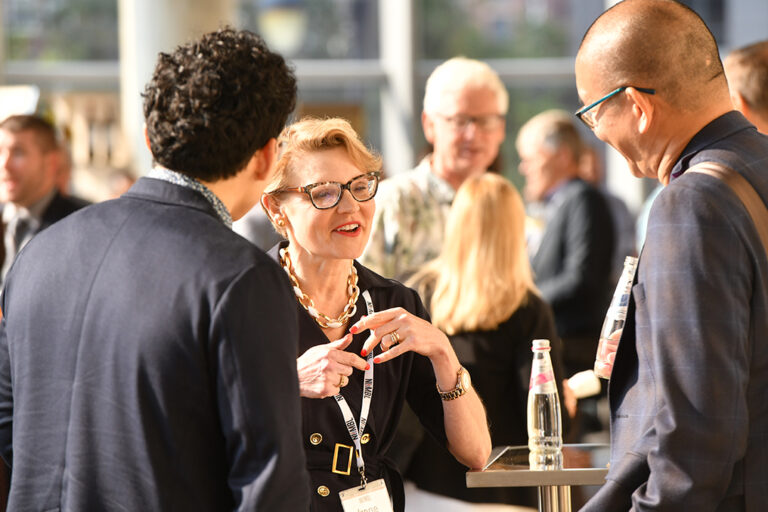 Members talking at a NIIMBL event